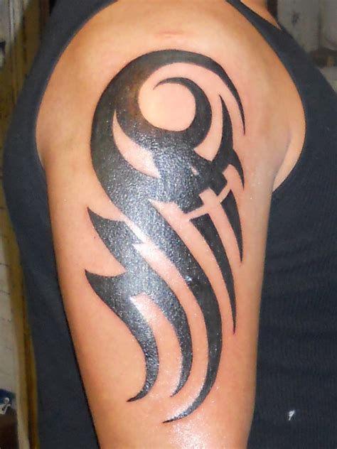 tribal arm tattoo|tribal arm tattoo for men.